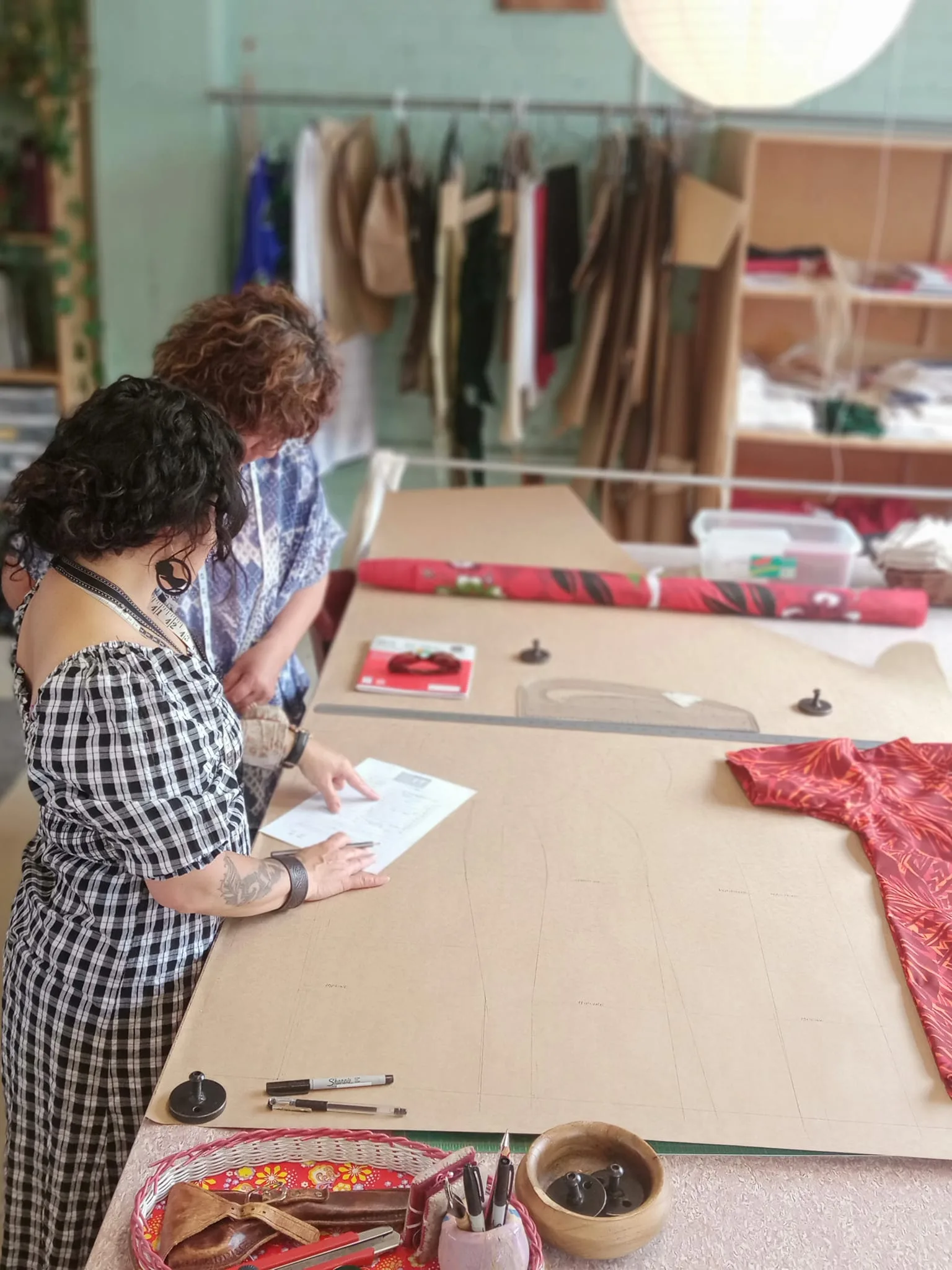 Hands working with fabric in Paetuia Studio